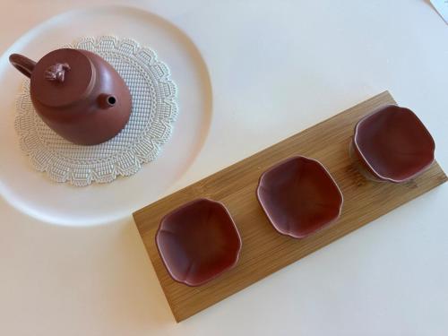 a plate of chocolates next to a plate of chocolate at Box Hill luxury 29th floor apartment with car park in Box Hill