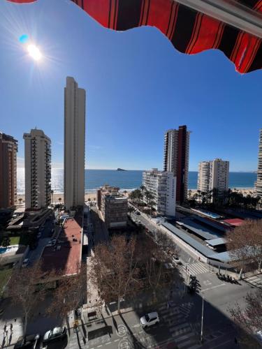 a view of a city with buildings and the ocean at Hany apartment Ducado 12-E in Benidorm