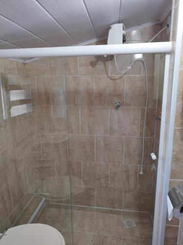 a bathroom with a shower with a toilet at Pousada Bela Vista 1 in Petrópolis