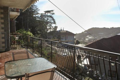 a balcony with a table and a view at Le Mimose Terrace in Bordighera