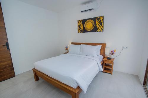 Ένα ή περισσότερα κρεβάτια σε δωμάτιο στο The Cove Bali
