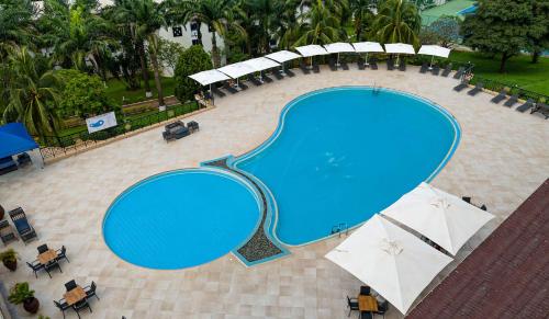 an overhead view of a large swimming pool at Lancaster Kumasi City in Kumasi