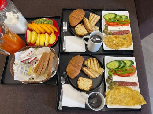 a tray filled with different types of food on a table at Julies Vila in Ksamil