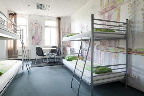 Voodi või voodid majutusasutuse Hostel Jena toas
