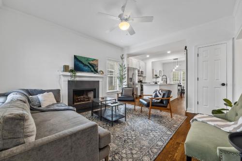 a living room with a couch and a fireplace at Perfect In-Town location! KINGbed, BBQ and Parking in Atlanta