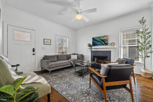 a living room with a couch and a fireplace at Perfect In-Town location! KINGbed, BBQ and Parking in Atlanta
