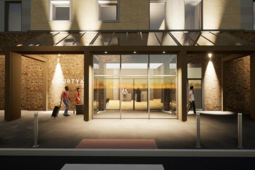 a rendering of a lobby with people walking into a store at Courtyard by Marriott Sheffield in Sheffield