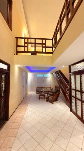 a room with benches and stairs in a building at Hotel & Pousada Italia Beach - Porto Das Dunas in Aquiraz