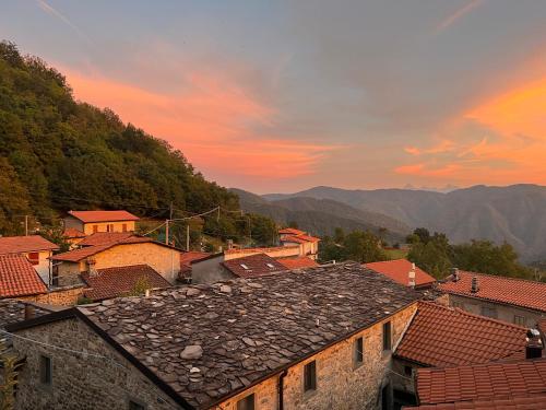 a view of a town with mountains in the background at Agriturismo Montagna Verde Apella in Licciana Nardi