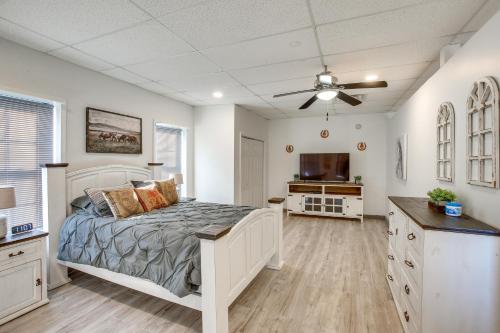a bedroom with a bed and a flat screen tv at 8 Mi to Kentucky Downs Quiet Getaway with Patio in Portland