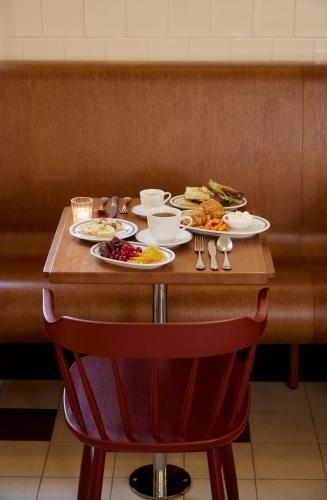 a table with plates of food on it at Stockholm Stadshotell in Stockholm