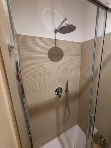 a shower with a glass door in a bathroom at Casa Marí in Montefiascone