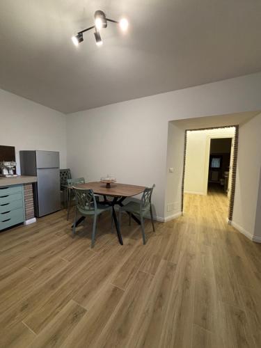 an empty room with a table and chairs in a kitchen at Casa Marí in Montefiascone