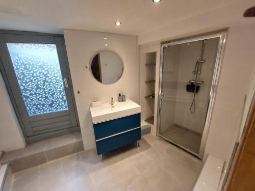 a bathroom with a sink and a shower at Cosy appartment in Arnhem