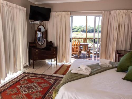 Katil atau katil-katil dalam bilik di Riverview Guesthouse