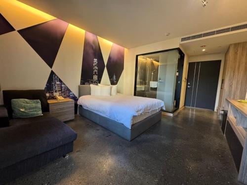 Postel nebo postele na pokoji v ubytování Travel Light Hotel