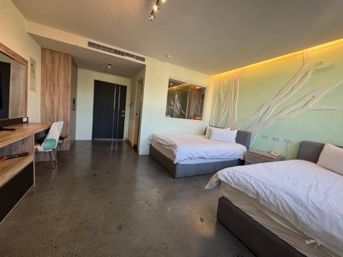Postel nebo postele na pokoji v ubytování Travel Light Hotel