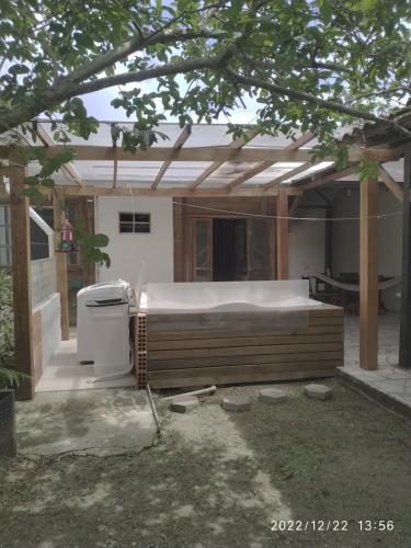 a house with a large bed in the backyard at Casa com Jacuzzi em Itapoa, 400m da Praia Aceita Pets in Itapoa