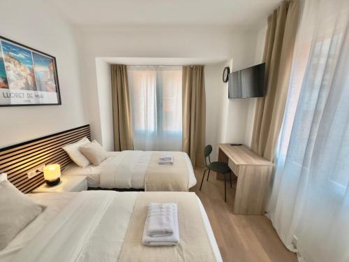Ένα ή περισσότερα κρεβάτια σε δωμάτιο στο Hotel LM