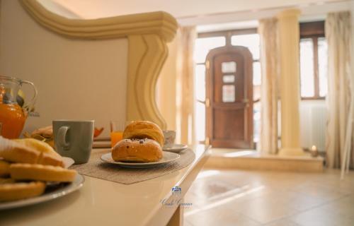 a table with two plates of pastries on it at Conte Cavour - casa vacanze in Laterza