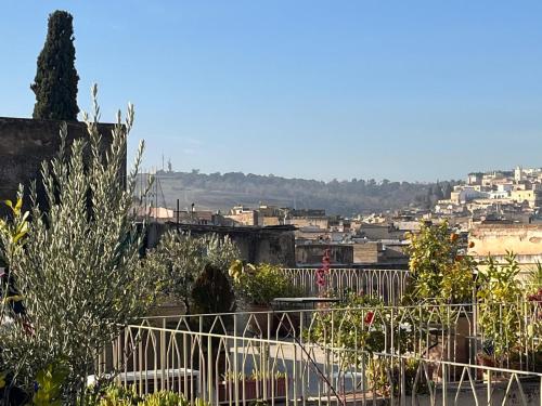 a view of a city from a balcony at Riad Palais Bahia Fes in Fès