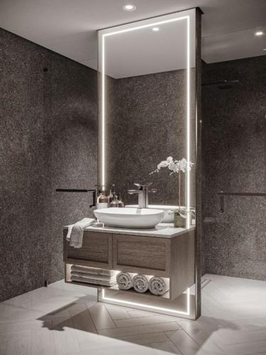 a bathroom with a sink and a mirror at Stylish Boutique Loft Duplex, Near Circle Mall, Balcony, Fast WiFi, 2 Pools and Gym in Dubai