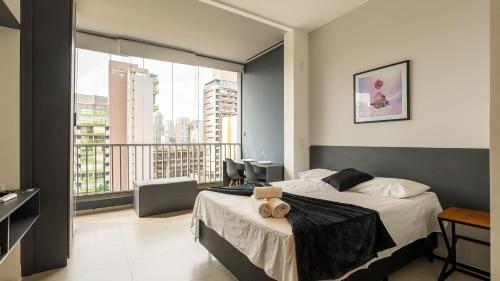 Postel nebo postele na pokoji v ubytování Studios Novíssimos com Piscina no Rooftop e vista para o Allianz Parque