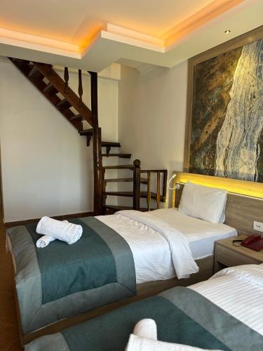 Letto o letti in una camera di The Kumsal Hotel Oludeniz
