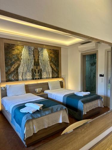 Letto o letti in una camera di The Kumsal Hotel Oludeniz