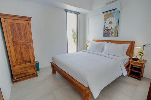Ένα ή περισσότερα κρεβάτια σε δωμάτιο στο The Cove Bali