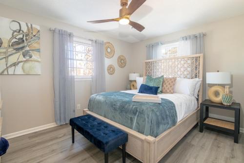 a bedroom with a bed and a ceiling fan at Family friendly & 5-mins to downtown Graham in Graham