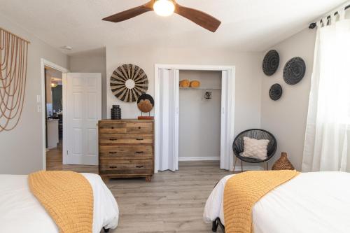 a bedroom with a bed and a ceiling fan at Family friendly & 5-mins to downtown Graham in Graham
