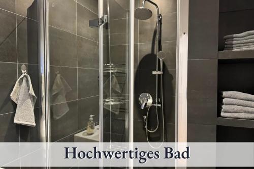 a shower with a shower head in a bathroom at Relax Apartments Bad Waldsee One in Bad Waldsee
