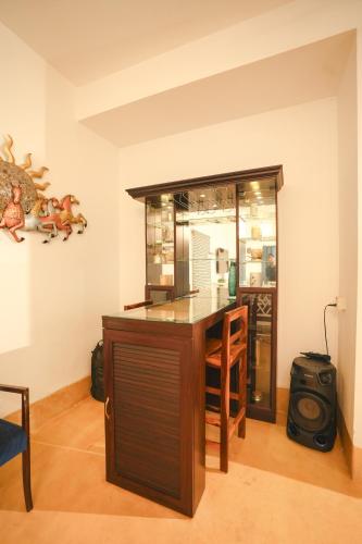 a kitchen with a table and a counter top at VILLA M - SOLITUDE 2 CANDOLIM GOA 3BHK, Pool Facing, Near Beach, Free Breakfast, Free WIFI and Prime Location in Candolim