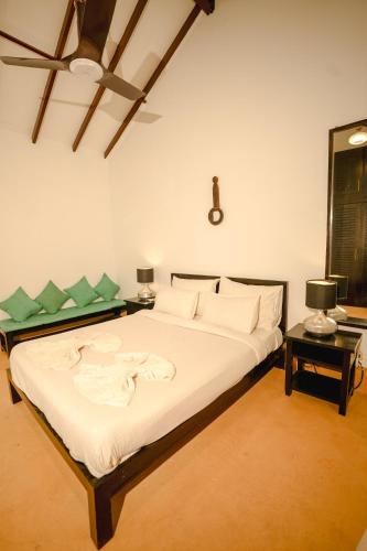a bedroom with a large bed in a room at VILLA M - SOLITUDE 2 CANDOLIM GOA 3BHK, Pool Facing, Near Beach, Free Breakfast, Free WIFI and Prime Location in Candolim