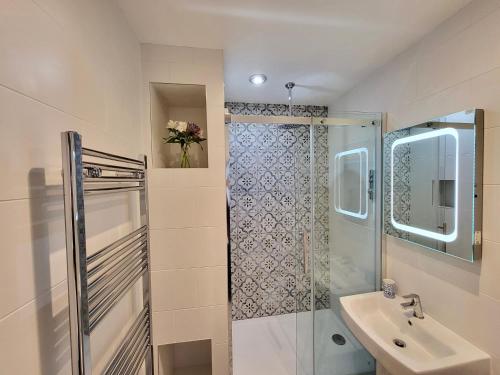 a bathroom with a shower and a sink at St George's Guest House in York