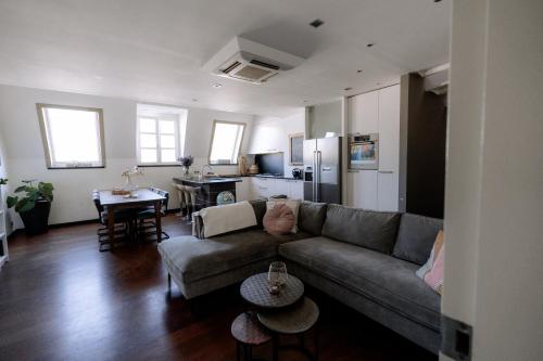 a living room with a couch and a table at W Y C K - E N D boutique hotel in Maastricht