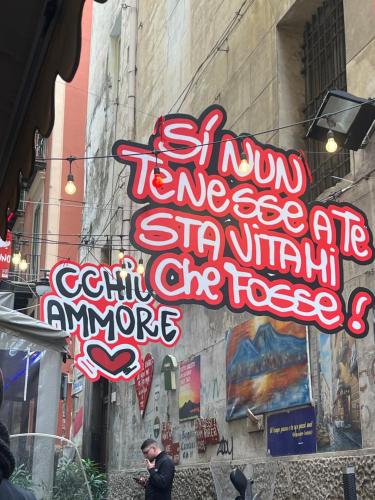 a sign that is on the side of a building at Casetta Piazza Plebiscito in Naples