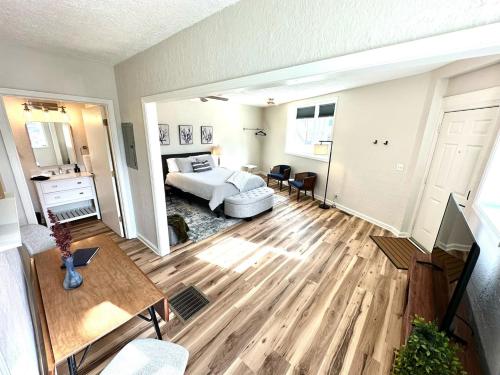 a living room with a bed and a table at University Suite "a" in Marion