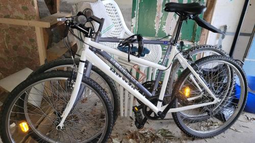 a white bike parked in a room at Studio du Pont Tournant in Cherbourg en Cotentin
