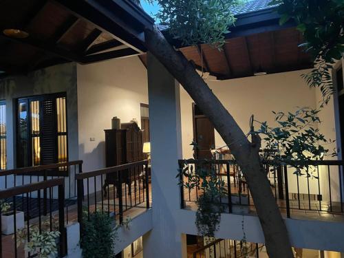 a building with a balcony with plants on it at Birders Urban Retreat in Sri Jayewardenepura Kotte