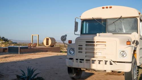 a white truck is parked in the dirt at Secluded-jt-spa-pool-firepit-sauna-game Room! in Yucca Valley
