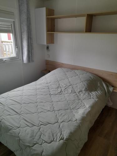 Postel nebo postele na pokoji v ubytování Mobil home