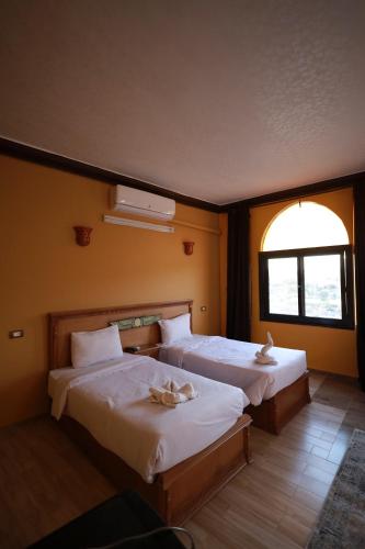 Cama o camas de una habitación en Nubiano Cataract