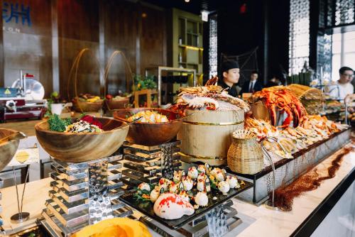 a buffet with many different types of food on display at InterContinental Hanoi Landmark72 by IHG in Hanoi