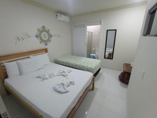 Postel nebo postele na pokoji v ubytování Mandala Hostel Maragogi Oficial