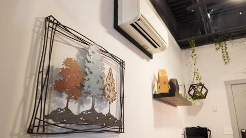 a picture of trees in a glass on a wall at Rivers Edge Lofts - Unit 7 in Niles