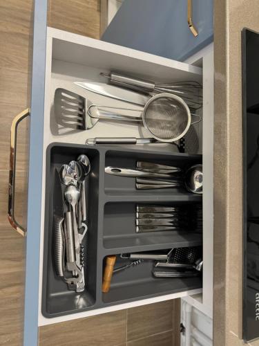 a drawer filled with utensils in a kitchen at Michael2 in Galaţi
