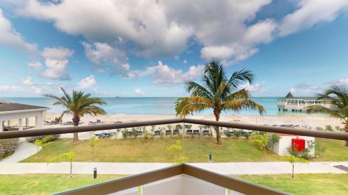 a view of the beach from the balcony of a resort at Royalton CHIC Antigua, An Autograph Collection All-Inclusive Resort - Adults Only in Saint Johnʼs