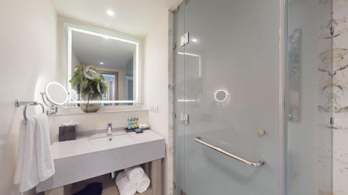 a bathroom with a sink and a shower at Royalton CHIC Antigua, An Autograph Collection All-Inclusive Resort - Adults Only in Saint Johnʼs